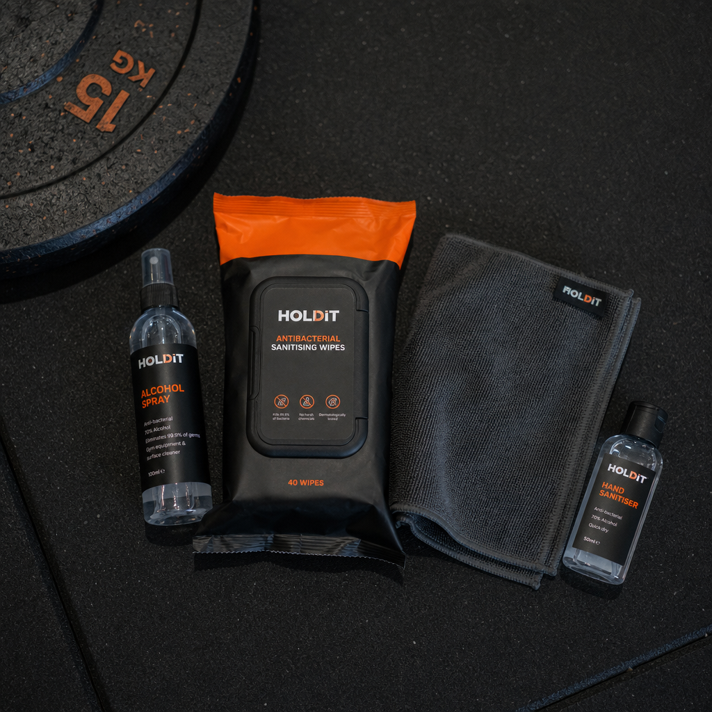 Essential gym hygiene supplies laid out on a flat surface.